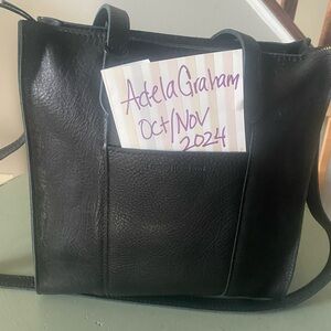 Brand new never used large Lola pebbled black zip